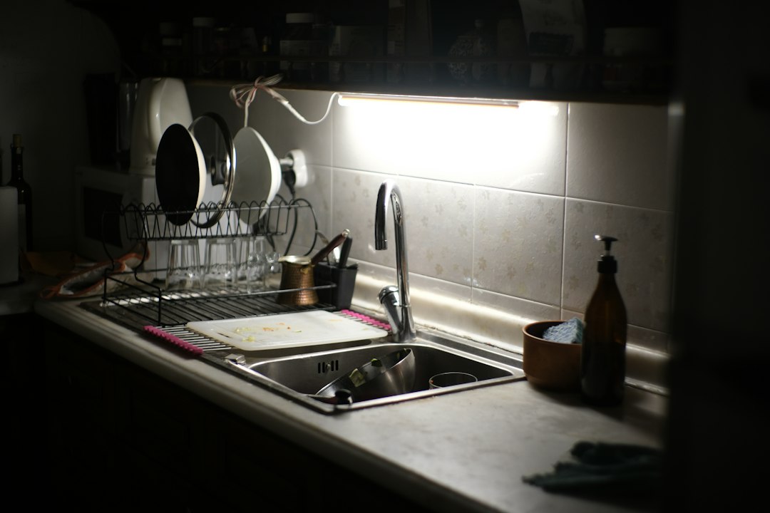 A kitchen sink with dishes drying