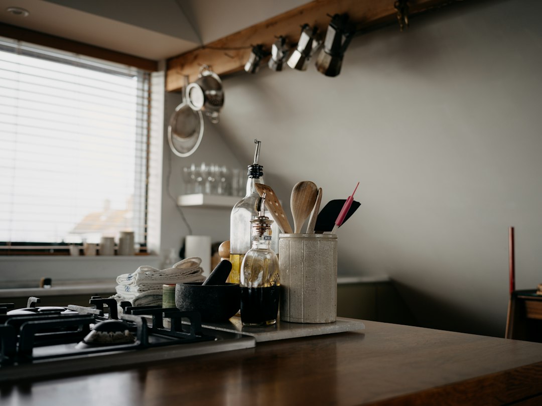 Kitchen counter with cooking utensils and bottles